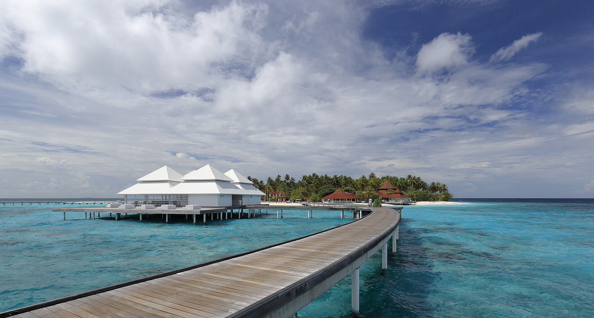 Water villas over a turquoise lagoon in the Maldives